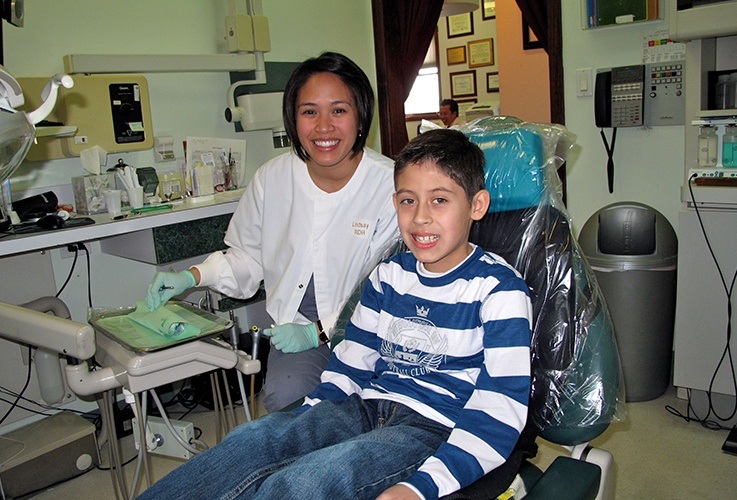 boy smiling in chair