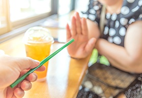 Woman rejecting a straw