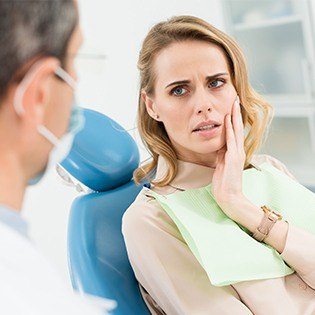 woman looking at dentist working