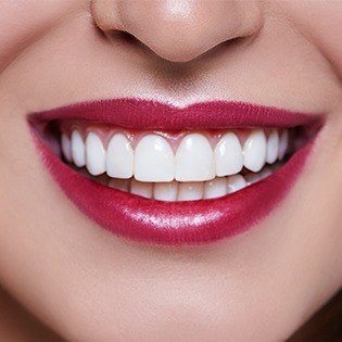 woman smiling with lipstick on