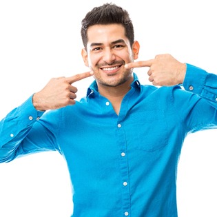 A man pointing to his smile