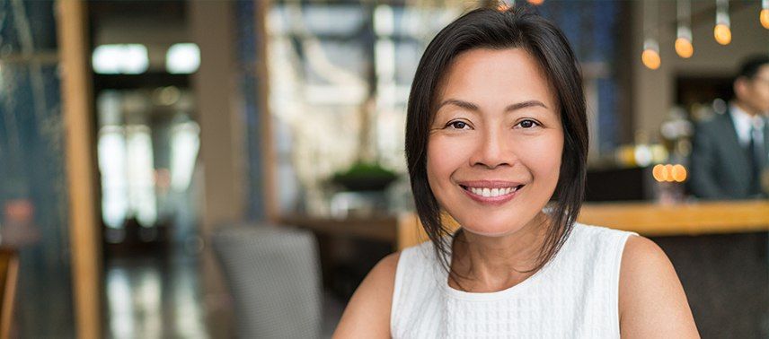 woman in white dress smiling