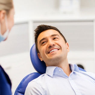 man learning the difference between traditional dental implants and All-On-4