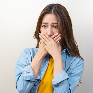 man embarrassed of breath