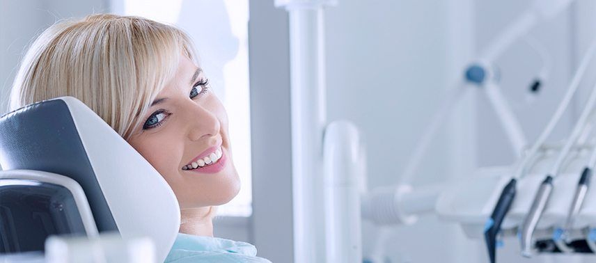 blonde woman smiling over shoulder