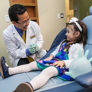 Dr smiling at little girl