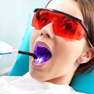 A UV Light being used to harden dental sealants