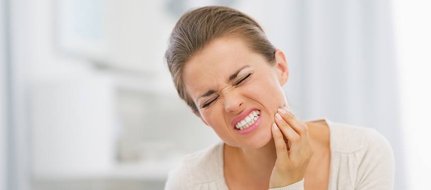 woman gritting teeth hard