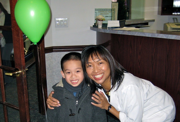 boy with green balloon