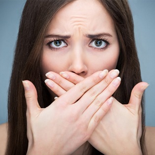 A woman covering her mouth