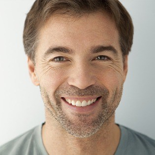 man with beard smiling