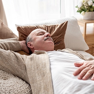 Man resting on a couch