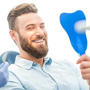 man with full beard smiling