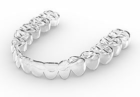 Single Invisalign tray on white surface