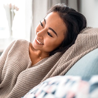 relaxed person lounging on a couch