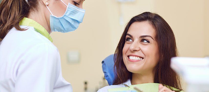 woman smiling at assistant