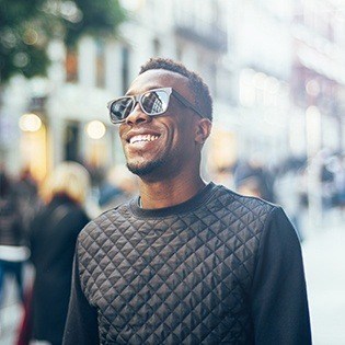 man with sunglasses smiling