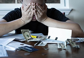 Woman stressed by finances