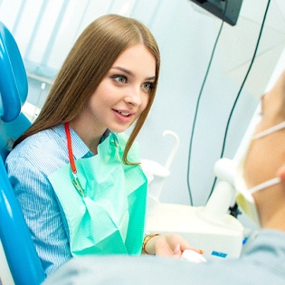 A woman talking to her dentist