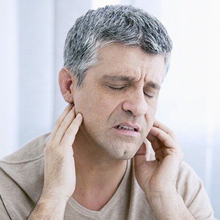 man with neck pain