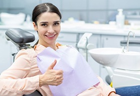 Happy patient making thumbs-up gesture