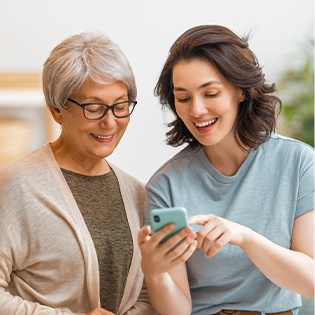 woman showing another woman about the super hero club